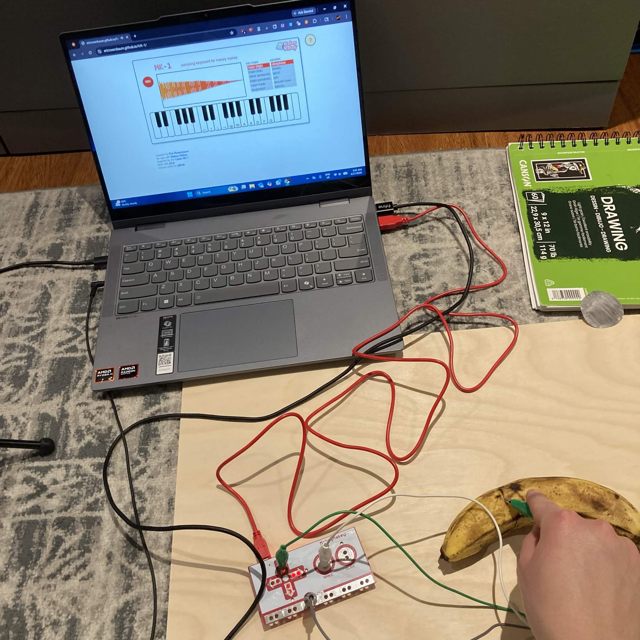 playing the piano note using the alligator clip on the banana